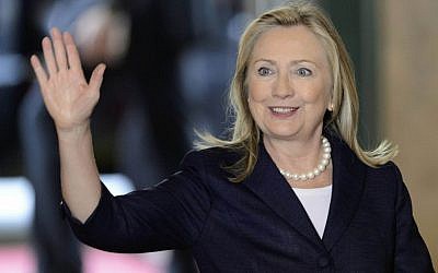 US Secretary of State Hillary Rodham Clinton waves as she arrives for a meeting of the Action Group for Syria at the European headquarters of the United Nations in June. (photo credit: AP)