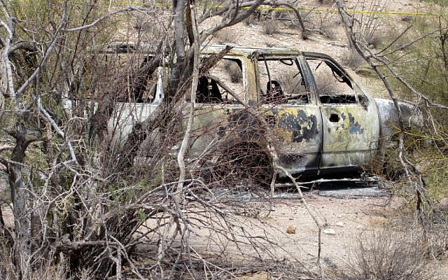 The Butwins' torched car, found in the desert. (photo credit: (AP/ Pinal County Sheriffs Office) The Butwins' torched car, found in the desert. (photo credit: (AP/ Pinal County Sheriffs Office)