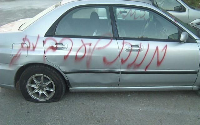 Graffiti reading 'Death to Arabs' spray-painted on cars at Neve Shalom. (photo crediti: keano_16, Twitter)
