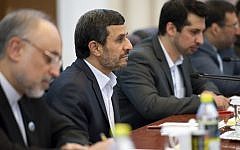 Iran's President Mahmoud Ahmadinejad, center, attends a meeting with China's then premier Wen Jiabao on the sidelines of the Shanghai Cooperation Organization summit, in Beijing last year (photo credit: AP/Ed Jones)