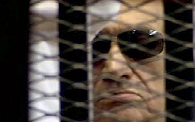 In this video image taken from Egyptian State Television, 84-year-old former Egyptian president Hosni Mubarak is seen in the defendant's cage as a judge reads the verdict on charges of complicity in the killing of protesters during last year's uprising that forced him from power, in Cairo, Egypt, Saturday (AP/Egyptian State TV)