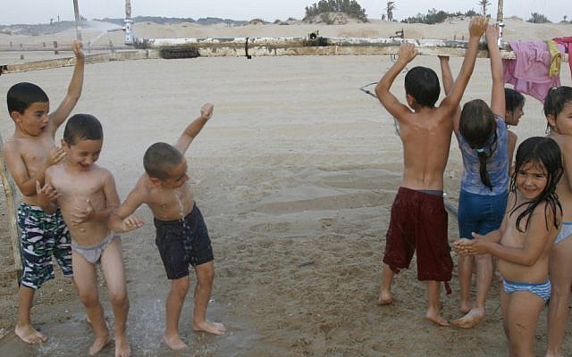 File photo of Israeli children celebrating summer at Nitzanim beach in southern Israel (photo credit: Nati Shohat/Flash90)