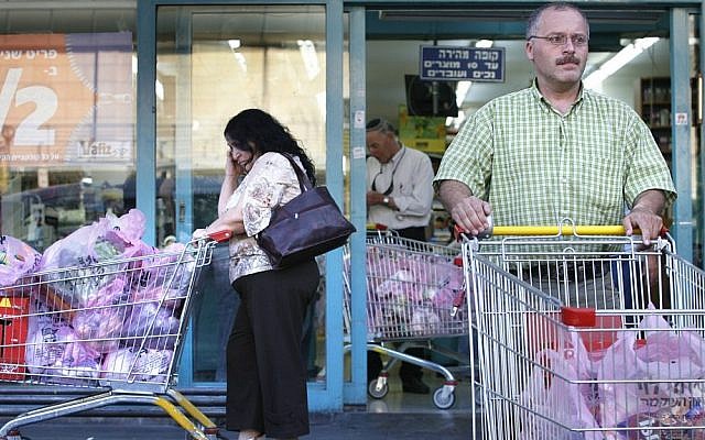 Shoppers outside a supermarket (Illustrative photo credit: Michal Fattal/Flash90) Shoppers outside a supermarket (Illustrative photo credit: Michal Fattal/Flash90)