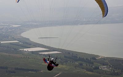 Illustrative: A paraglider flies over northern  Israel in 2009. (Matanya Tausig/Flash90)