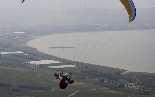 Illustrative: A paraglider flies over northern  Israel in 2009. (Matanya Tausig/Flash90)