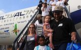 New immigrants from USA and Canada arriving at Ben Gurion Airport (photo credit: Kobi Gideon/Flash90)