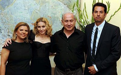 Madonna and Guy Oseary flanking the Netanyahus in 2009 (photo credit: Avi Ohayon/Flash 90) Madonna and Guy Oseary flanking the Netanyahus in 2009 (photo credit: Avi Ohayon/Flash 90)