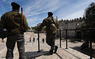Israeli Border Police stand outside Damascus Gate of Jerusalem's Old City (illustrative photo credit: Gili Yaari/Flash 90)