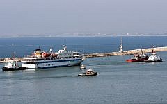 The Mavi Marmara is tugged out of Haifa harbor long after the raid (photo credit: Herzl Shapira/Flash 90)