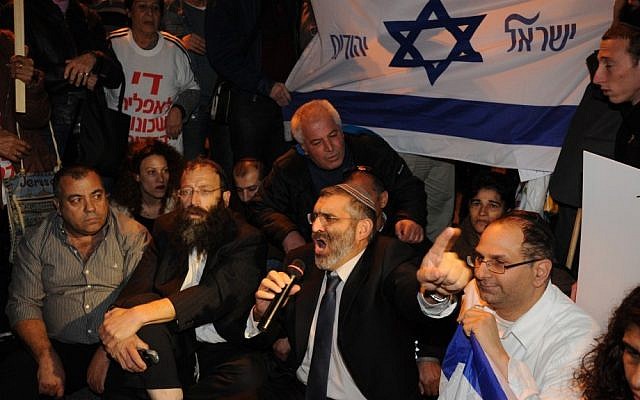 MK Michael Ben Ari (third from left) and right wing activist Baruch Marzel (second from left) at a Tel Aviv protest in 2011 (photo credit: Gili Yaari/Flash 90) MK Michael Ben Ari (third from left) and right wing activist Baruch Marzel (second from left) at a Tel Aviv protest in 2011 (photo credit: Gili Yaari/Flash 90)