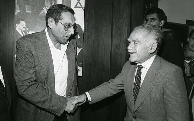 Rehavam Zeevi (left) shakes hands with former prime minister Yitzhak Shamir. (photo credit: Moshe Shai/Flash90)