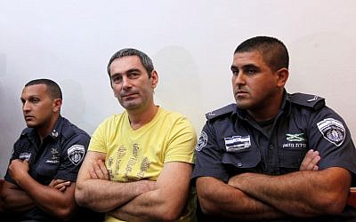 Aleksander Cvetkovic (center) in court, August 2011 (photo credit: Kobi Gideon/Flash90)