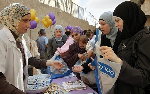 Arab women attend the opening of a new infant care clinic in east Jerusalem in 2011. ( Miriam Alster/Flash90)
