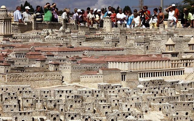 Tourists look at a model of the Second Temple on display at the Israel Museum in Jerusalem. (photo credit: Miriam Alster/Flash90)