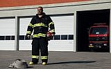 Firefighter Yosef Ben Yosef in 2011.  Are the fire brigades better equipped to handle another disaster?  (photo credit: Avishag Shar Yashuv/FLASH90)