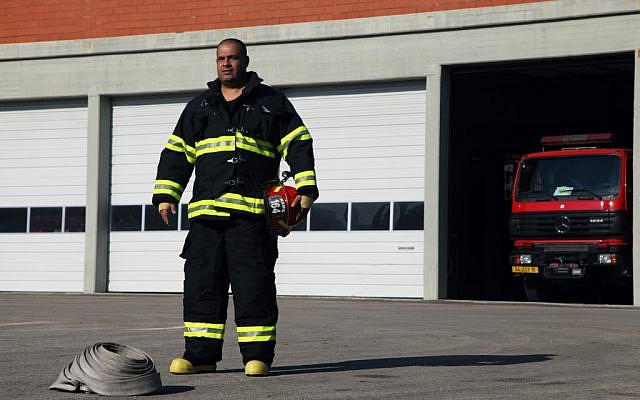 Firefighter Yosef Ben Yosef in 2011.  Are the fire brigades better equipped to handle another disaster?  (photo credit: Avishag Shar Yashuv/FLASH90)