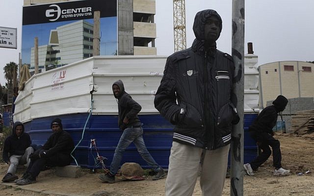 African foreign workers looking for work in a corner street in Ashkelon. (photo credit: Tsafrir Abayov/Flash90)