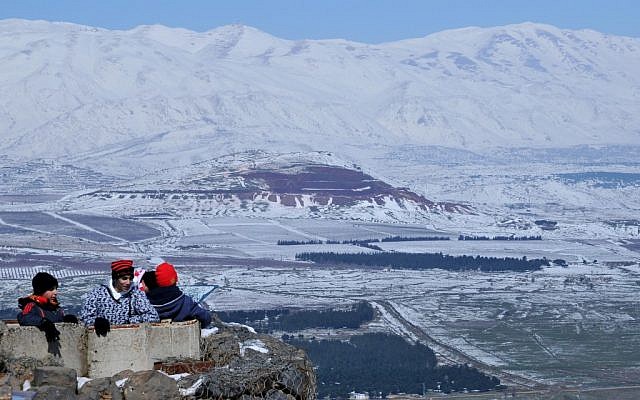 Tourists look at the view from the the snow covered Mount Bental in the Golan Heights. February 21, 2012 (Photo: Shay Levy/FLASH90) Tourists look at the view from the the snow covered Mount Bental in the Golan Heights. February 21, 2012 (Photo: Shay Levy/FLASH90)