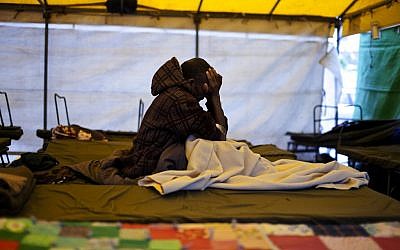 A Sudanese asylum-seeker in Levinsky Park in February (photo credit: Dima Vazinovich/Flash90)