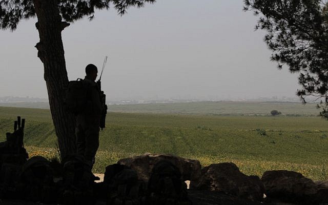 An Israeli soldier guarding near the Gaza border in April. (photo credit: Tsafrir Abayov/Flash90)