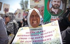 Palestinians rally in the Sheikh Jarrah neighborhood in Jerusalem on a Friday in early May (photo credit: Noam Moskowitz/Flash90)