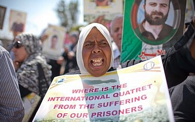 Palestinians rally in the Sheikh Jarrah neighborhood in Jerusalem on a Friday in early May (photo credit: Noam Moskowitz/Flash90)