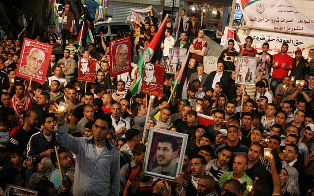 Palestinians celebrating the announcement in May 2012 that prisoners had ended a hunger strike after striking a deal with Israeli authorities. (photo credit: Issam Rimawi/Flash90)