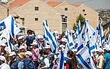 Residents of the threatened Givat Ulpana neighborhood in Beit El and their supporters protesting on Monday the court-ordered demolition of five of the neighborhood's buildings.  (photo credit: Noam Moskowitz/Flash90)