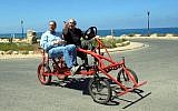 Prime Minister Benjamin Netanyahu and journalist Peter Greenberg on a bike. (photo credit: Avi Ohayon/Flash90)