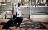 Illustrative photo: A South Sudanese migrant prepares last week to leave Israel (photo credit: Tali Mayer/Flash90)