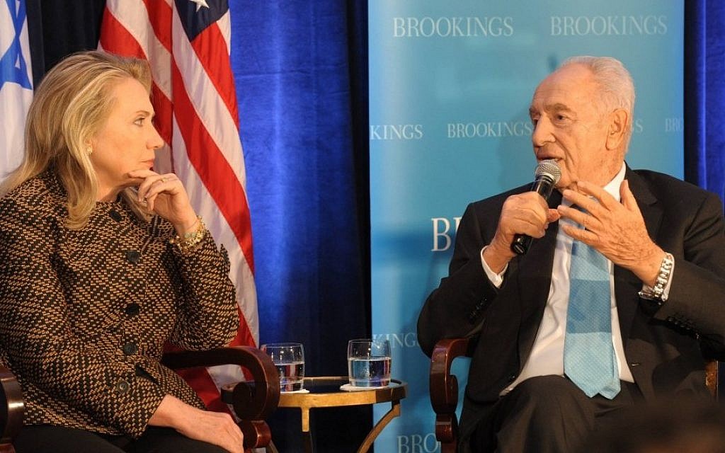 US Secretary of State Hillary Clinton and President Shimon Peres speak about the Middle East at the Brookings Institution's 12th anniversary in Washington in June (photo credit: Amos Ben Gershom/GPO/Flash90)