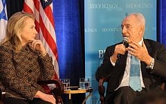 US Secretary of State Hillary Clinton and President Shimon Peres speak about the Middle East at the Brookings Institution's 12th anniversary in Washington in June (photo credit: Amos Ben Gershom/GPO/Flash90)
