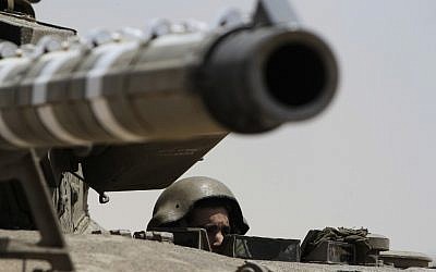 An Israeli tank along the Egyptian border (photo credit: Tsafrir Abayov/Flash90)