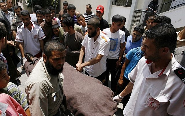 The body of Islamic Jihad terrorist Ghaleb Armilat is carried by Palestinians in Gaza on Wednesday (photo credit: Abed Rahim Khatib/Flash 90)