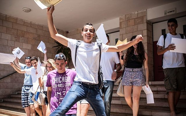 High school students in Jerusalem seen with their report cards on their last day of school. (Photo credit: Noam Moskowitz/Flash90