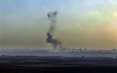Smoke rises following an Israeli Air Force airstrike in the Gaza Strip in June (Photo credit: Tsafrir Abayov/ Flash 90)