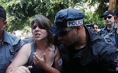 Daphni Leef is arrested by police in June during a demonstration on Tel Aviv's Rothschild Boulevard. (photo credit: Roni Schutzer/Flash90)
