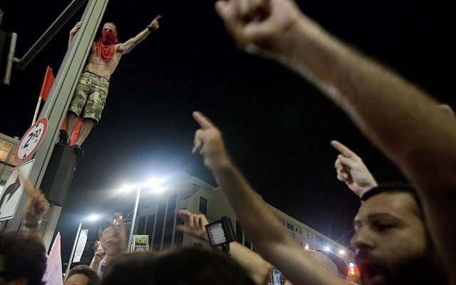 Protesters demonstrating against the cost of living in clash with police in Tel Aviv on June 24. (photo credit: Tali Mayer/Flash90)