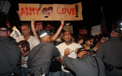 Protesters in Tel Aviv Saturday night. (photo credit: Roni Schutzer/Flash90)