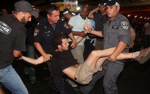 Police arrest protesters during a rally in Tel Aviv Saturday (photo credit: Roni Schutzer/Flash90) Police arrest protesters during a rally in Tel Aviv Saturday (photo credit: Roni Schutzer/Flash90)