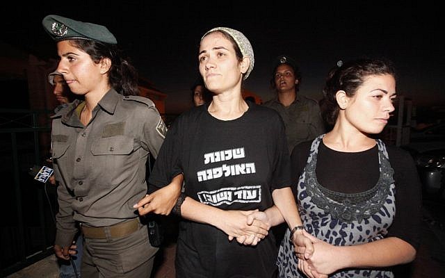 The Fattal family being forcibly evacuated from the Ulpana outpost in the West Bank settlement of Beit El (photo credit: Miriam Alster/Flash90)