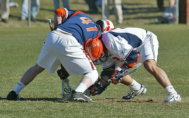 Face-off in a US college lacrosse match (photo credit: CC-BY 2.0, by Yarnalgo, Wikimedia Commons)