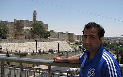 Kasim Hafeez stands outside Jerusalem's Old City (photo credit: Elhanan Miller/ Times of Israel)