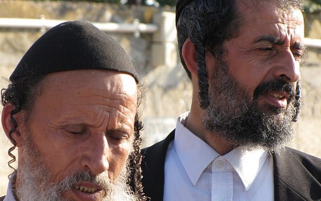 Family members pray for Aharon Zandani at the Rehovot cemetery Wednesday (photo credit: Elhanan Miller/Times of Israel)