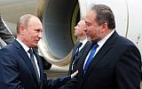 Then-Foreign Minister Avigdor Liberman greets Russian President Vladimir Putin at Ben Gurion Airport, June 25, 2012. (Kobi Gideon/GPO)