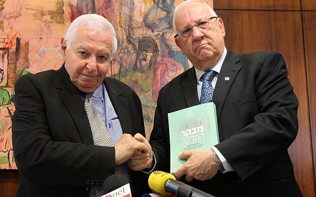 State Comptroller Micha Lindenstrauss submits his report on the Carmel forest fire to Knesset Speaker Reuven Rivlin on Wednesday (photo credit: Miriam Alster/Flash90)