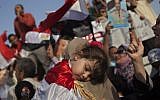 An Egyptian girl sleeps during a pro-Shafiq rally in Cairo Saturday (photo credit: AP Photo/Bernat Armangue)