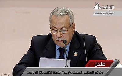 Judge Farouk Sultan, chairman of Egypt's election committee, announces the result of the presidential election at the State Information Service headquarters in Cairo, Egypt. (photo credit: AP/Egypt State TV) MANDATORY CR