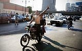 An Egyptian protester flashes the victory sign as he celebrates the victory of Mohammed Morsi of the presidential election in Tahrir square in Cairo, Egypt, Sunday, June 24, 2012. (photo credit: AP/Mohammed Abu Zaid)