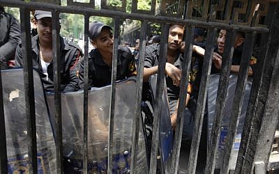 Anti-riot soldiers sit block the entrance of the Egyptian Parliament June 19 (photo credit: AP Photo/Amr Nabil)